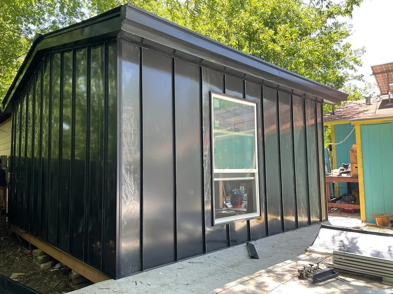 Black standing seam metal wall panels for Roof Inspection in London